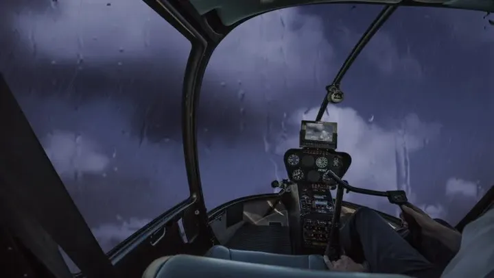 Can helicopters fly in rain or cloudy conditions?